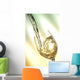 Pour white vine into glass with light background. Wall Mural