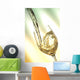 Pour white vine into glass with light background. Wall Mural