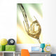 Pour white vine into glass with light background. Wall Mural