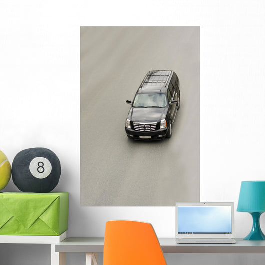 suv car cadillac escalade on the road Wall Mural