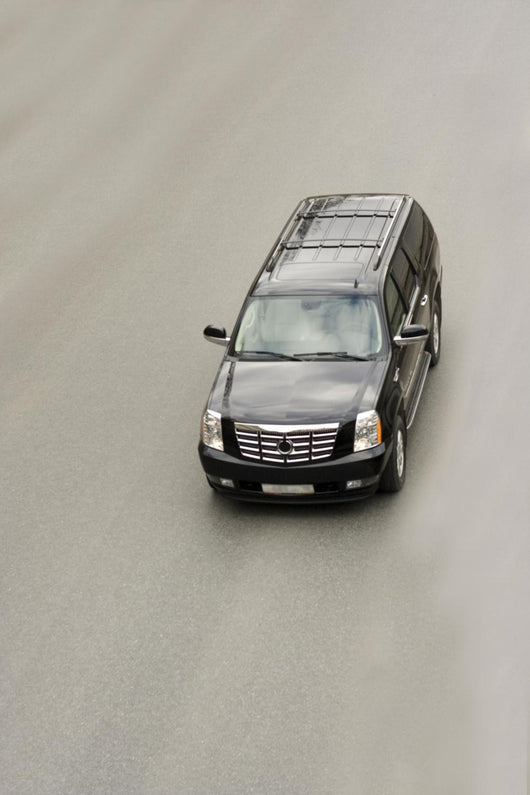 suv car cadillac escalade on the road Wall Mural