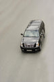 suv car cadillac escalade on the road Wall Mural