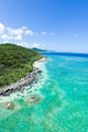 Aerial view of tropical island, clear blue water and coral reef Wall Mural