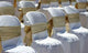 White Chairs with Gold Wall Decal