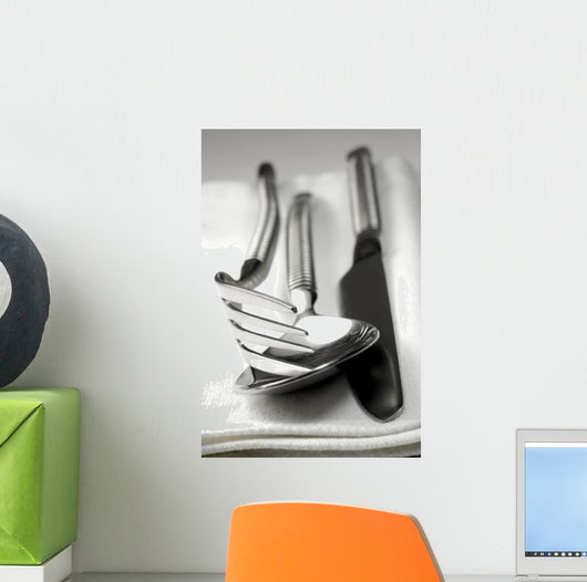 Cutlery resting on a white napkin Wall Mural