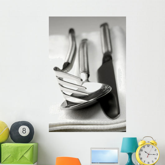 Cutlery resting on a white napkin Wall Mural