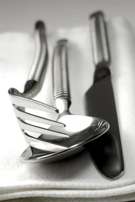 Cutlery resting on a white napkin Wall Mural