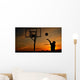 Silhouette of Teen Boy shooting a Basketball Wall Mural