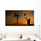 Silhouette of Teen Boy shooting a Basketball Wall Mural