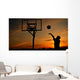 Silhouette of Teen Boy shooting a Basketball Wall Mural