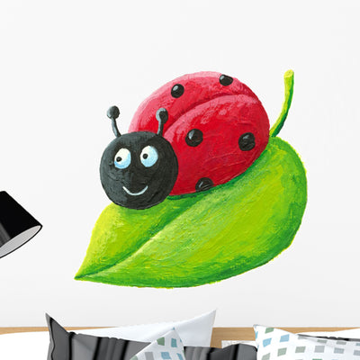Cute Ladybug Green Leaf Wall Decal shown on a wall