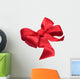 Red satin gift bow. Ribbon. Isolated on white Wall Decal