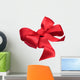 Red satin gift bow. Ribbon. Isolated on white Wall Decal