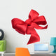 Red satin gift bow. Ribbon. Isolated on white Wall Decal