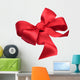 Red satin gift bow. Ribbon. Isolated on white Wall Decal