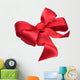 Red satin gift bow. Ribbon. Isolated on white Wall Decal