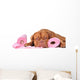 Puppy with two rolls of toilet paper Wall Decal