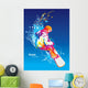 The colorful figure of a young man snowboarding on a blue sky ba Wall Mural