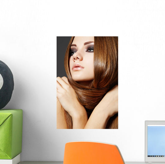 Hairstyle. Beautiful model with long shiny hair Wall Mural