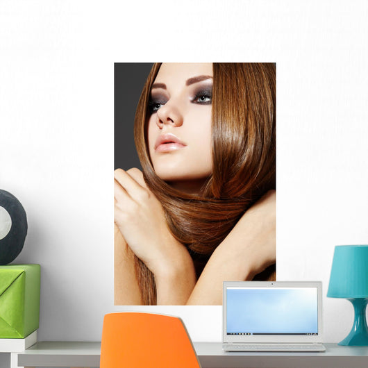 Hairstyle. Beautiful model with long shiny hair Wall Mural