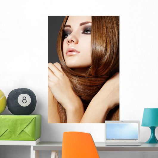 Hairstyle. Beautiful model with long shiny hair Wall Mural