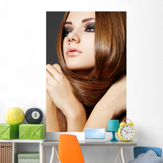 Hairstyle. Beautiful model with long shiny hair Wall Mural