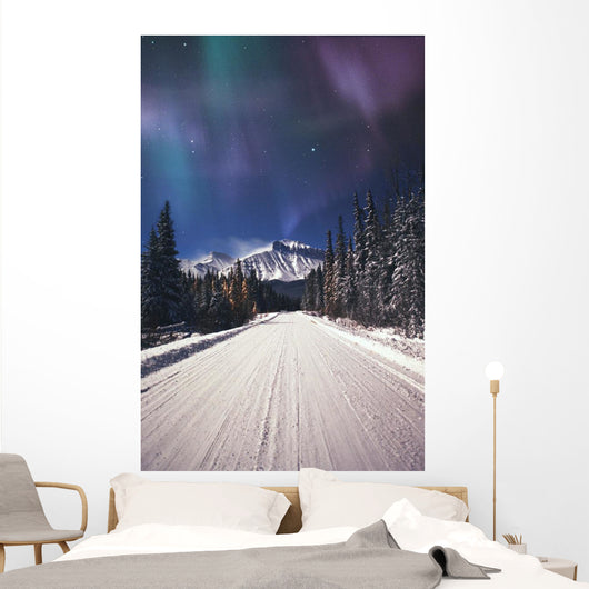 Northern Lights Over A Snowy Road Wall Mural