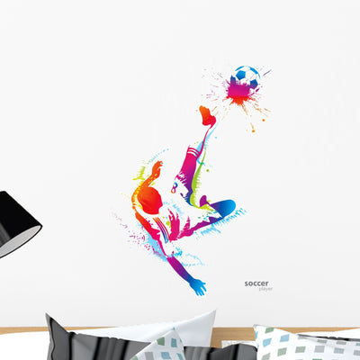 Soccer Player Kicks Ball Wall Decal shown on a wall