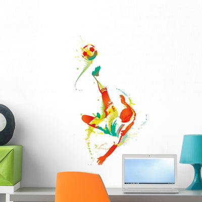 Soccer Player Kicks Ball Wall Decal shown on a wall