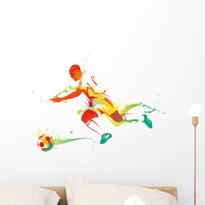 Young Man Playing Soccer Wall Decal shown on a wall
