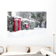 Red telephone and post box in the snow Wall Mural