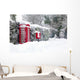 Red telephone and post box in the snow Wall Mural