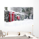 Red telephone and post box in the snow Wall Mural