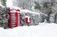 Red telephone and post box in the snow Wall Mural