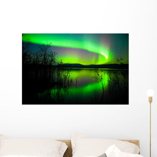 Northern lights mirrored on lake Wall Mural