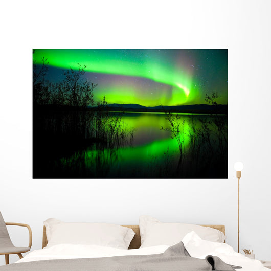 Northern lights mirrored on lake Wall Mural