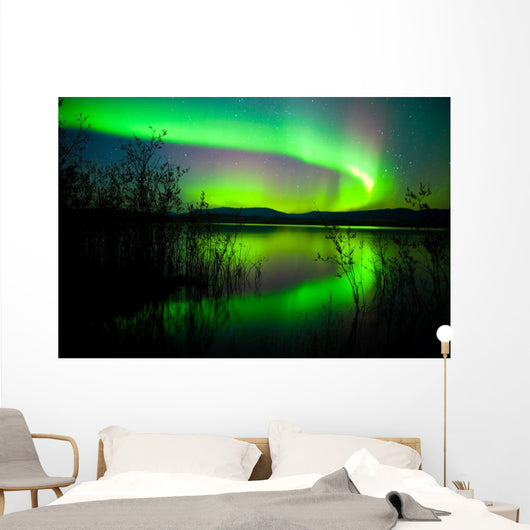 Northern lights mirrored on lake Wall Mural