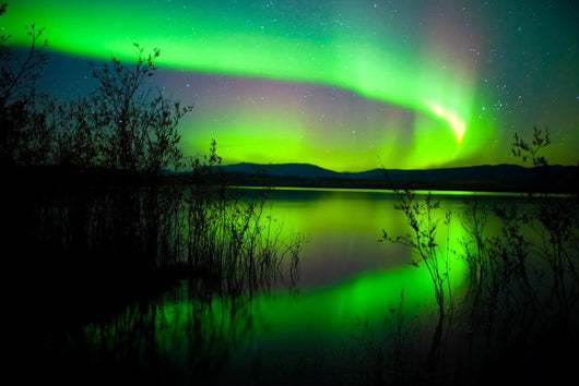 Northern lights mirrored on lake Wall Mural