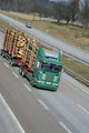 timber delivering truck on highway Wall Mural