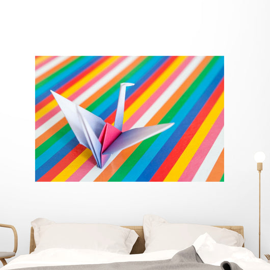 An origami bird on a colorful stripes background. Wall Mural
