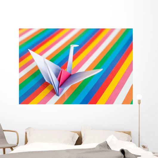 An origami bird on a colorful stripes background. Wall Mural