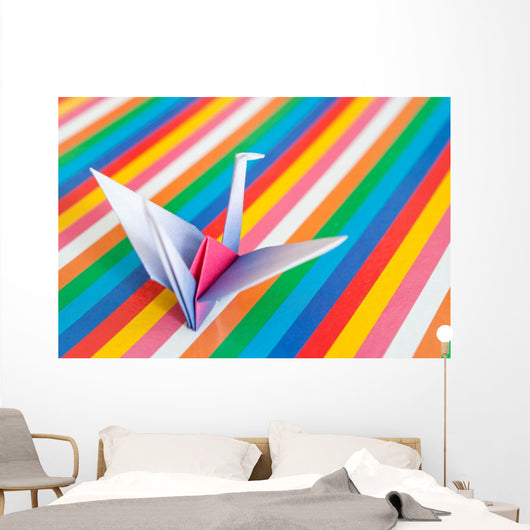 An origami bird on a colorful stripes background. Wall Mural