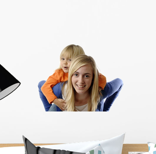 Teenage Girl Piggybacks Toddler