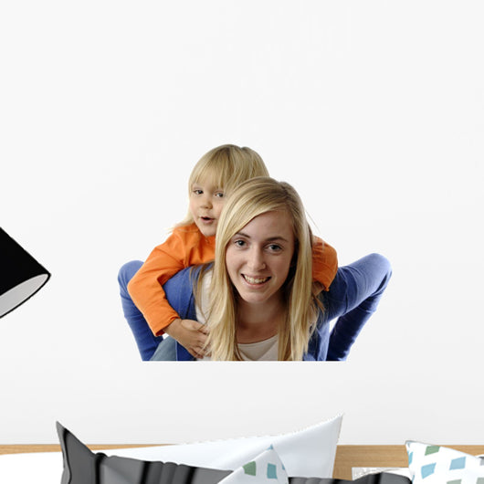 Teenage Girl Piggybacks Toddler