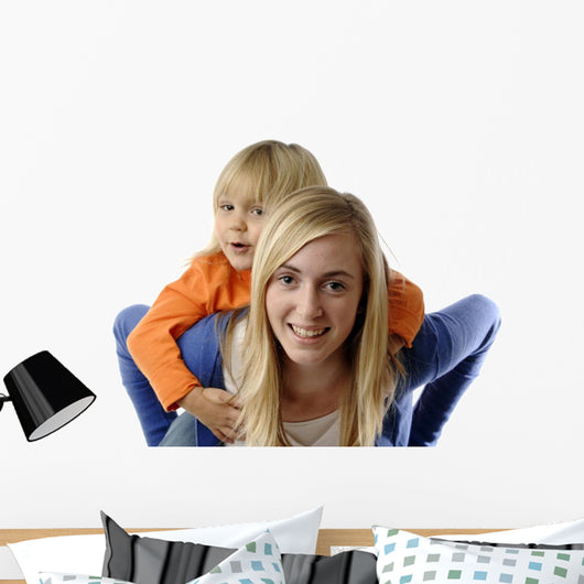 Teenage Girl Piggybacks Toddler