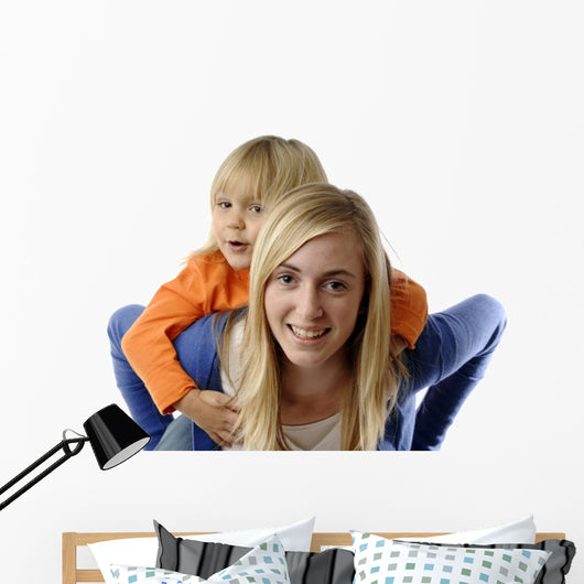 Teenage Girl Piggybacks Toddler