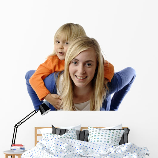 Teenage Girl Piggybacks Toddler