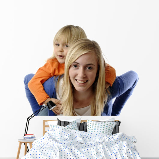 Teenage Girl Piggybacks Toddler