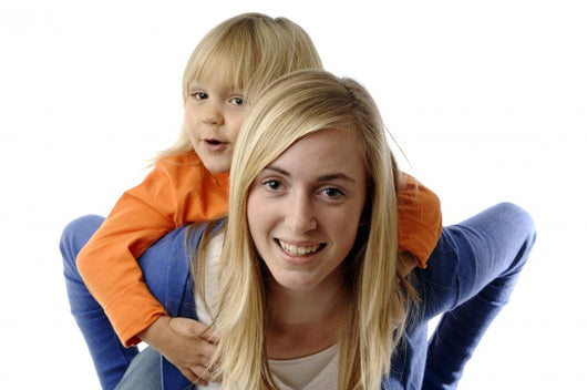 Teenage Girl Piggybacks Toddler
