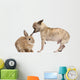 Chihuahua interacting with a rabbit in front of white background Wall Decal